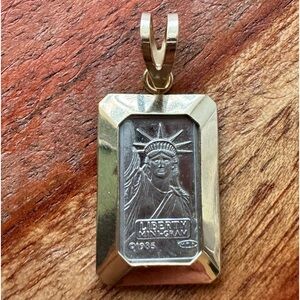 1985 Credit Suisse Liberty Mini Gram 1g platinum Bar in 14K gold Bezel Pendant.